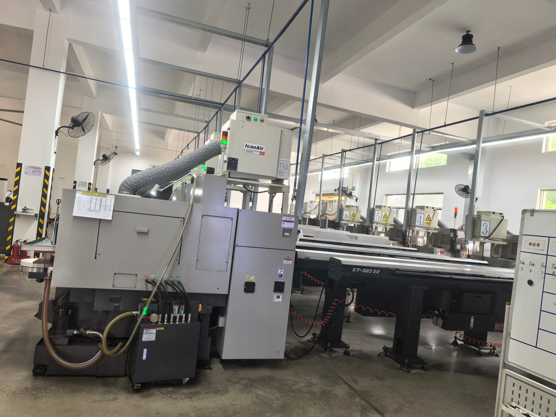 Automatic lathe bank with bar feeders