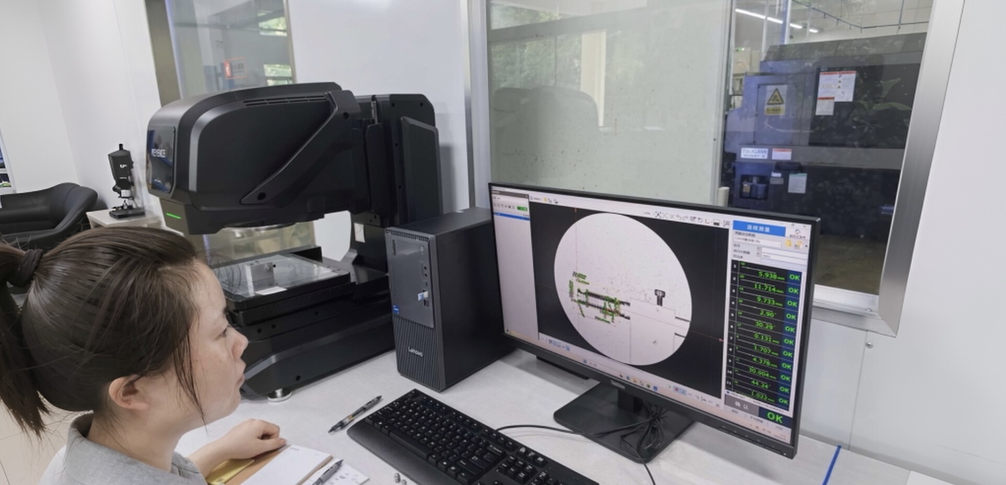 Operator running a vision measurement — KEYENCE IM-X series